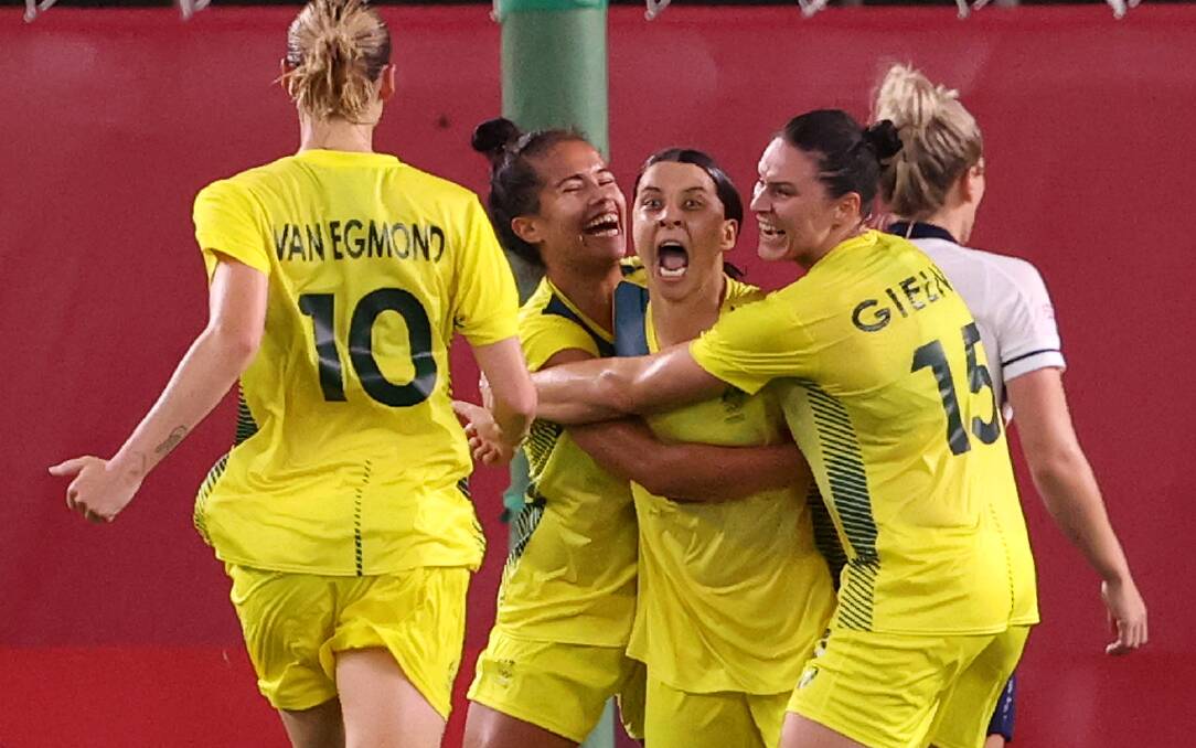 Sam Kerr is mobbed after putting the Matildas 4-2 up in extra-time. Picture: Getty Images