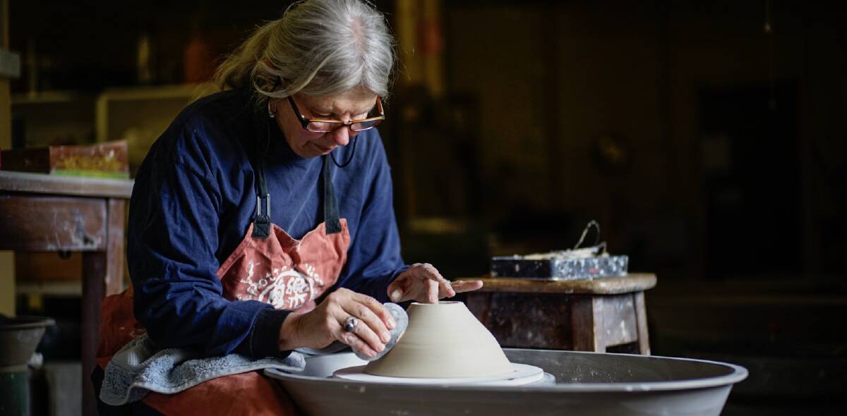 Focused: Armidale Pottery Club member Joan Relke puts the finishing touches on a ceramic bowl using one of the club's many pottery wheels.  Photo: MATT BEDFORD