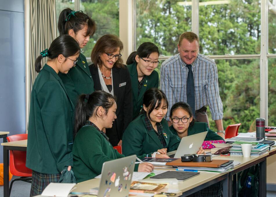 LEARNING TOGETHER: Pathways program director Chris Spencer and PLC school principal Nicola Taylor with students in the new international class.