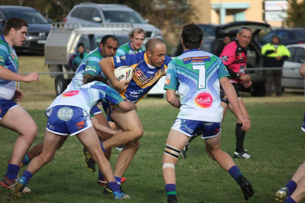 WORKHORSE: Narwan forward Steve Widders is wrapped up by the Armidale Rams defence on Saturday. Photo: Layne Franks.