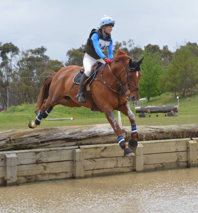INTO THE WATER: Isabelle McIntyre and Grandios tackle the water jump at last year's New England Girls' School one day event. This year's event will be November 19-20. 