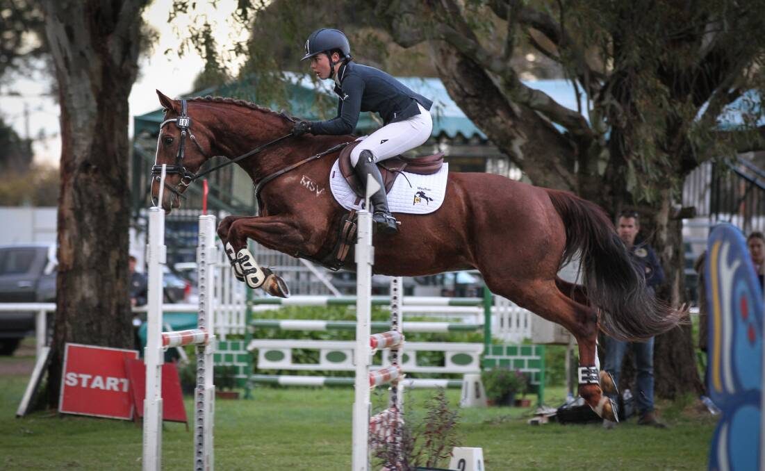 TOP OF THE CLASS: Jaimie McElroy and HH Hawke jump their way to victory in the junior 1* class at the Melbourne three day event. Photo: Michelle Terlato