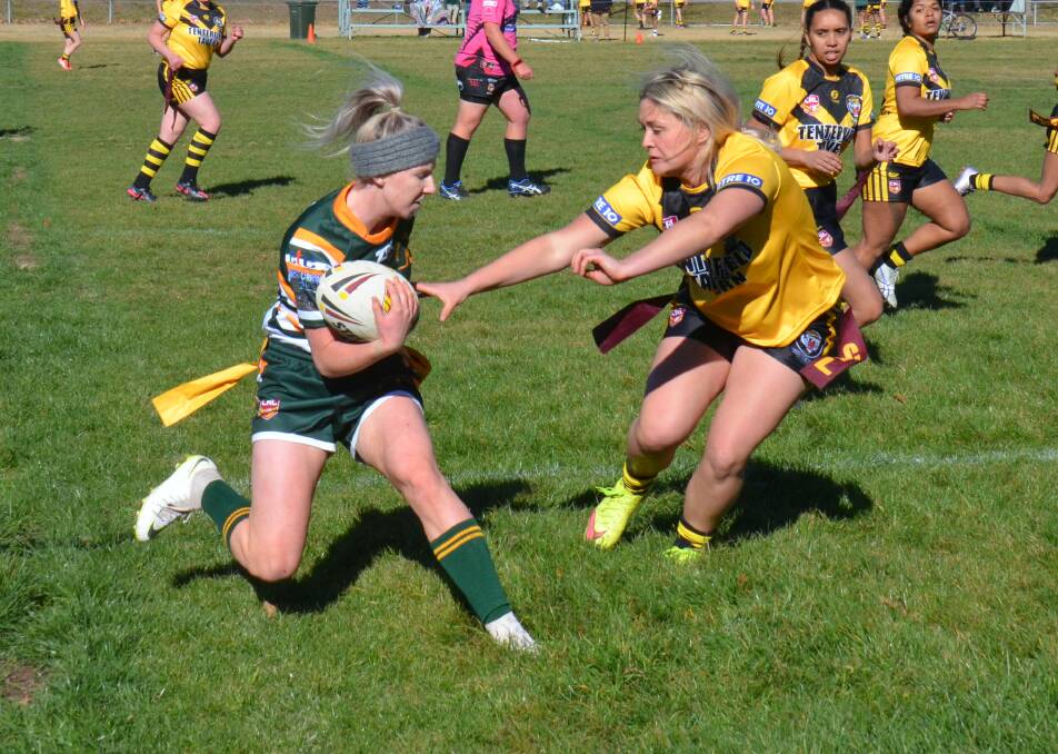 Emma Taylor-Anderson defends Walcha player Shae Partridge in Saturday's game. 