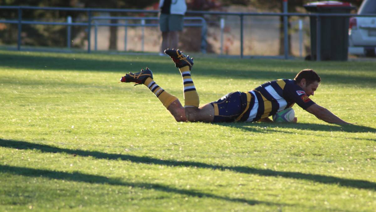 TRY TIME: John Roberts brought up 750 points for the Armidale Blues with a hat-trick in his side's 36-19 win over reigning premiers St Albert's College. Photo: Catherine Stephen. 
