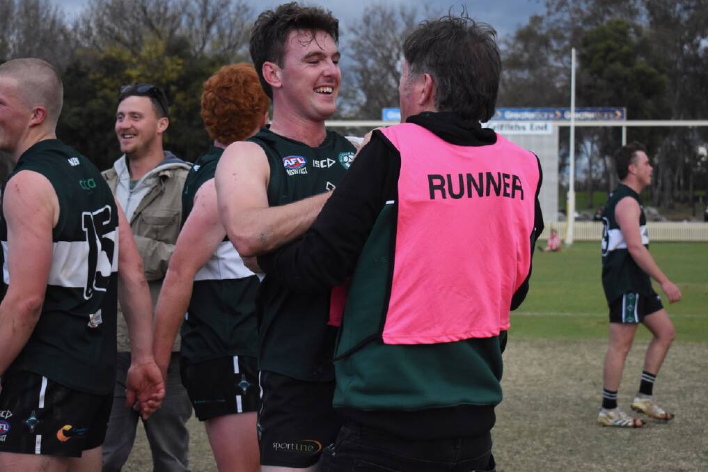 Clarrie Barker and Nomads president Adrian Walsh celebrate the 2022 premiership. Picture by Brad Greenshields.