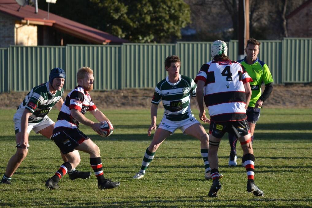 CLOSE FINISH: Will Chapman looks to offload in the match against Robb College on Saturday. Photo: Barbarians RUFC - Facebook. 
