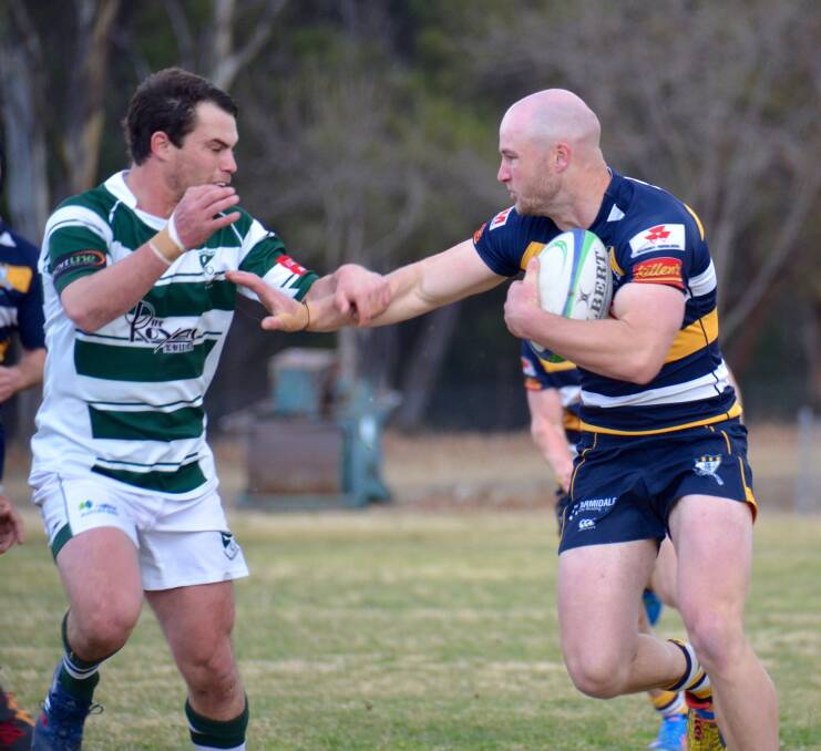 CONSISTENCY: Blues winger Sam Lomax attempts to fend off Robb College centre Tom Bucknell in Saturday's major semi-final. The Blues face the Baa Baas this Saturday for a spot in the grand final. 