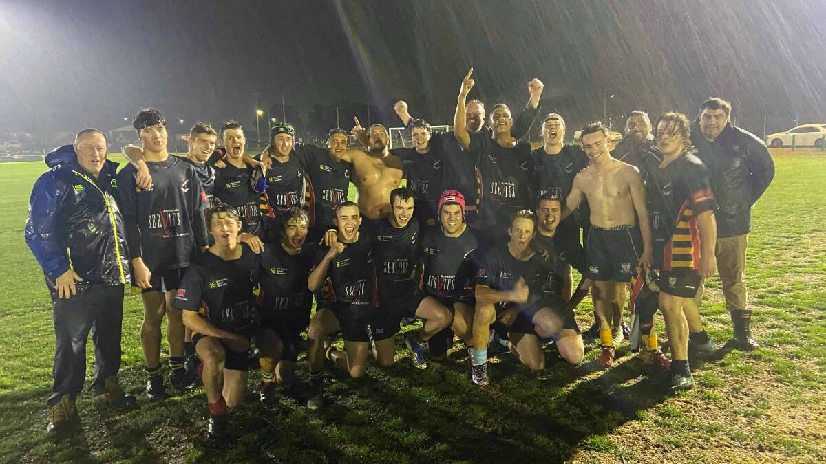 ECSTATIC: The inexperienced 'Mighty Mongrels' took on Farrer's First XV for a victory in atrocious conditions. 