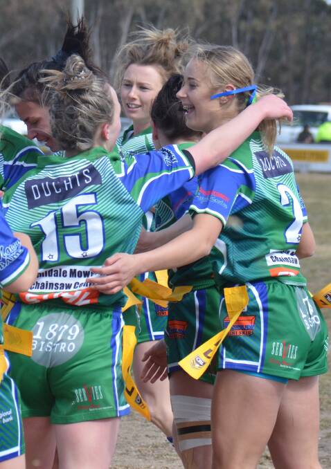 The Armidale Rams celebrate Hailee Grant's try against the Boars. 