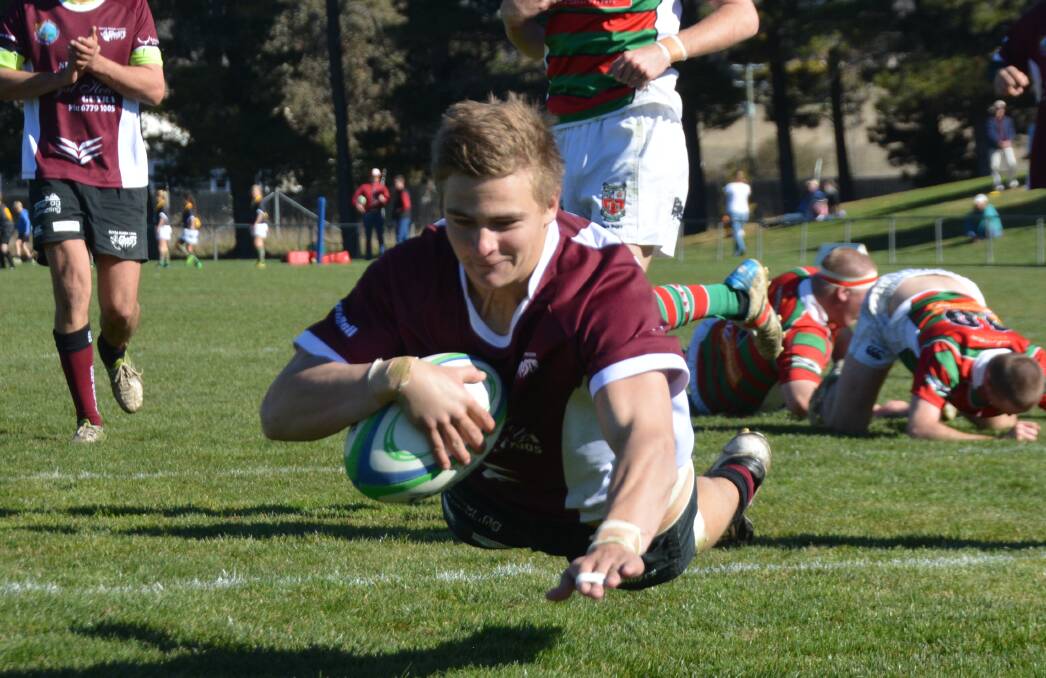 TOO GOOD: Pat Keen dives across the line in the Guyra Ghosts' 34-0 demolition of St Albert's College in the second grade semi-final on Saturday. 