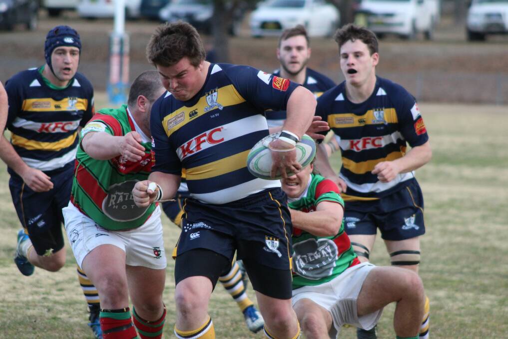 BUSTING THROUGH: Armidale Blues prop Mick Ogilvie splits open the St Albert's College defence on Saturday for their round 14 clash. Photo: Catherine Stephen. 