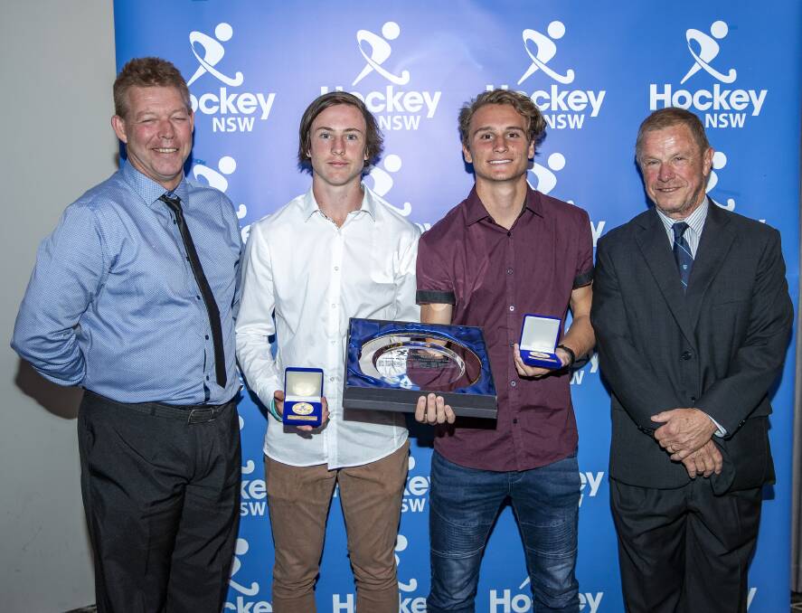 TRIUMPH: Ern Orth and Mike Ogilvie present Hockey NSW's junior male indoor player of the year to Nathan Czinner and Jake McCann. Photo: Greg Thompson - Click InFocus.
