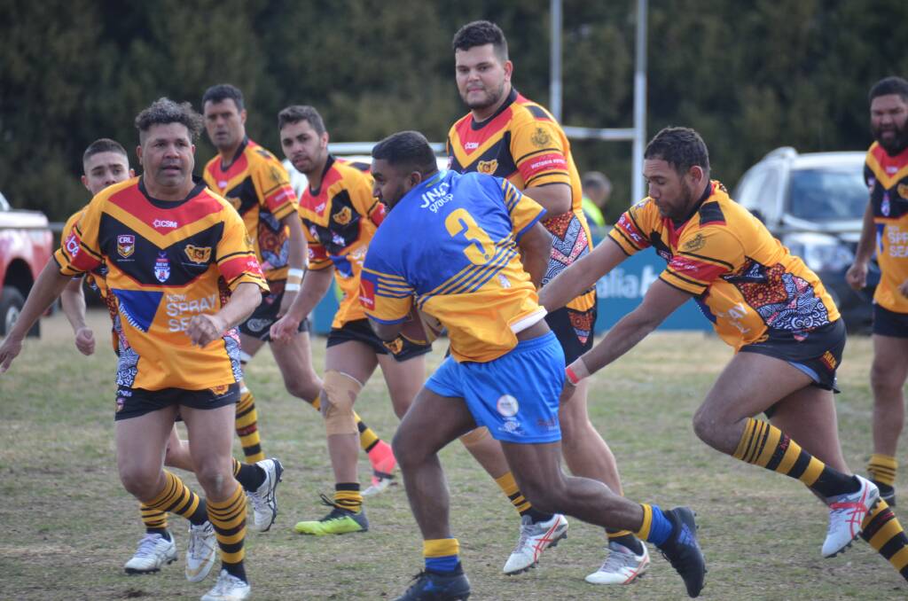 Fletcher Strong busts open the Boomerangs defence in the reserve grade major semi-final on Sunday. 