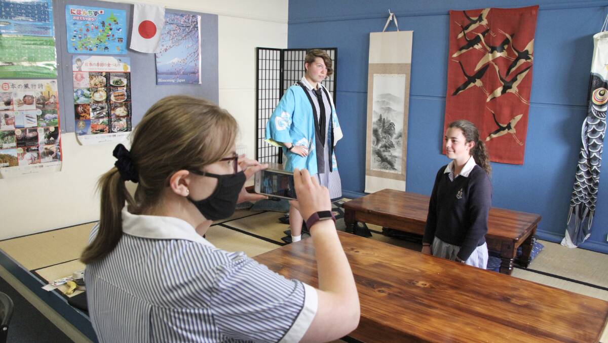 Olivia Lockett, Holly Dauparas and Bethan Palfreyman have taken out the junior division of a national competition for Japanese language students