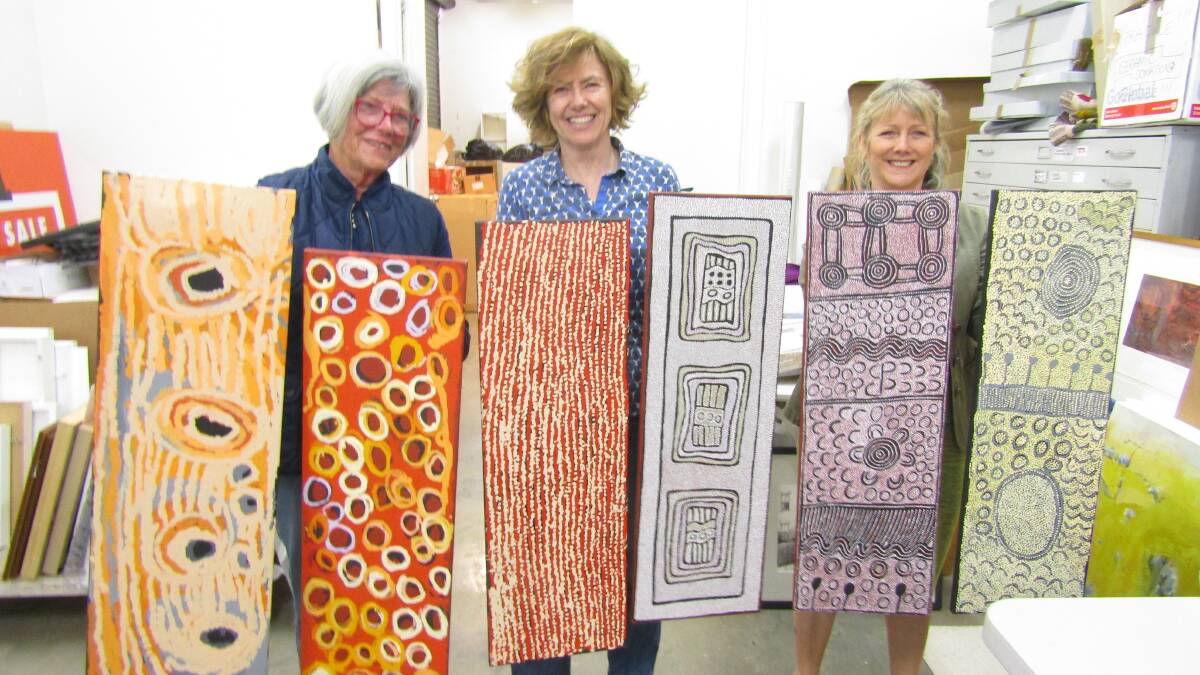  Liz Fulloon, Phillipa Charley Briggs and Frances Alter displaying works which have arrived from the Utopia Gallery, Sydney.