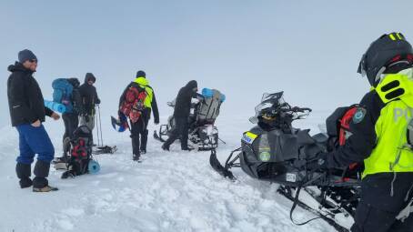 The police alpine operations team loading up the hikers to bring them back after the rescue on Tuesday. Picture: NSW Police 