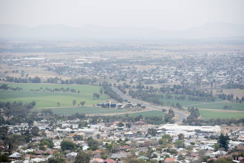 HAZY: Tamworth was blanketed by smoke on Tuesday morning before the winds picked up. Photo: Peter Hardin