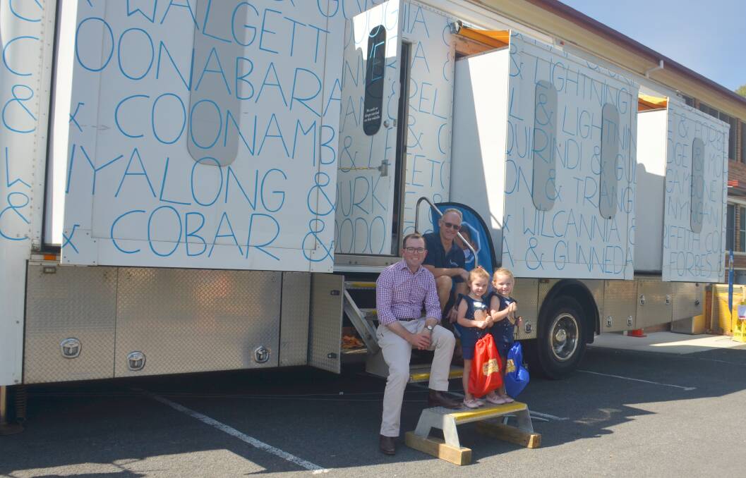 Member for Northern Tablelands Adam Marshall, Healthy Kids Bus Stop country services manager John Reid and patients Chloe and Annie Shawyer.
