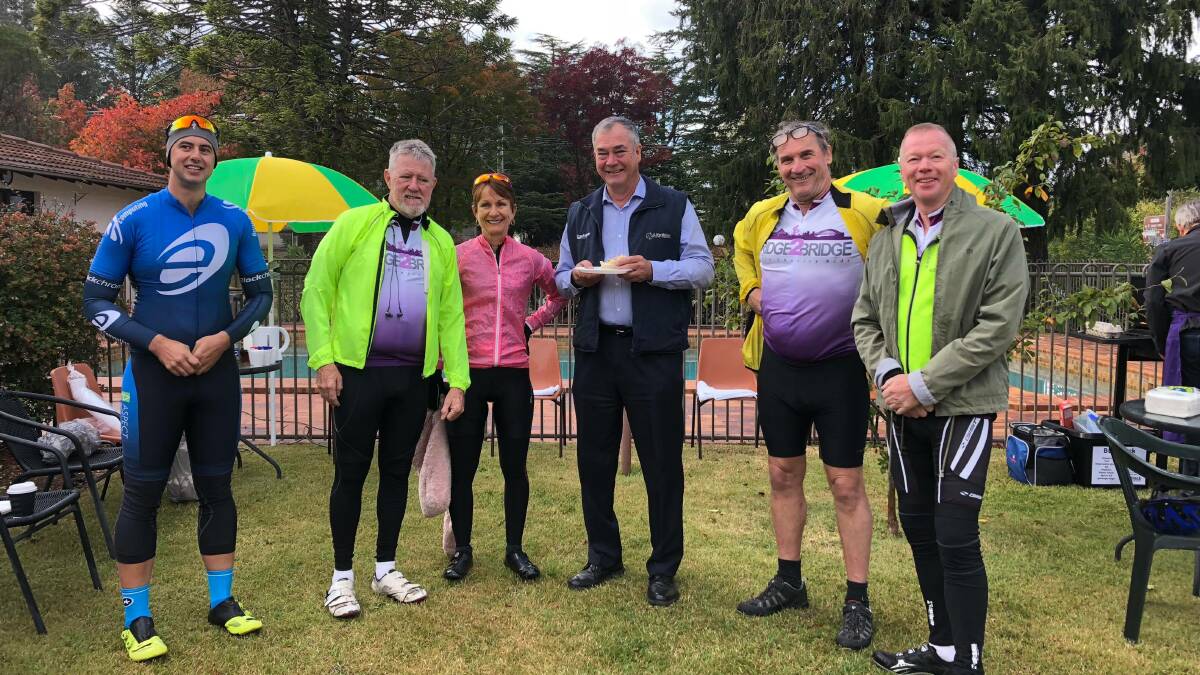 RIDE FOR CANCER: Bridge to Bridge cyclists stopped in Armidale for breakfast with Armidale Regional Council mayor Simon Murray before continuing on to Sydney. They have ridden from Brisbane's Story Bridge.