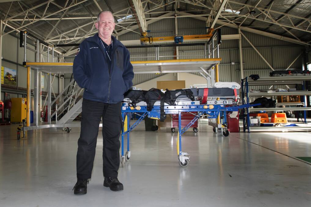 LIFE SAVER: Westpac Rescue Helicopter Service community liaison officer Barry Walton in the Tamworth hangar. Photo: Peter Hardin