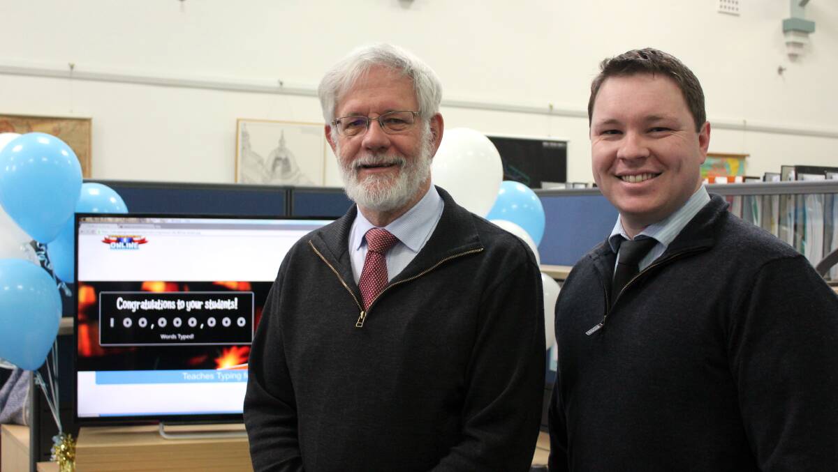 PUT TYPING TO THE TEST: EdAlive CEO Graham East with IT manager Jason Riley.