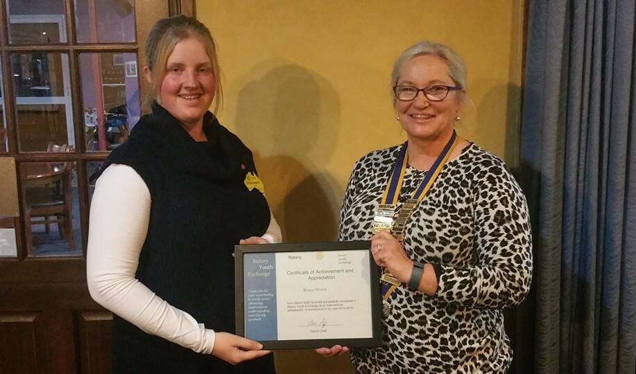 Rotary Youth Exchange student Briana Merritt is awarded her certificate of achievement by President of the Rotary Club of Guyra Aileen Macdonald