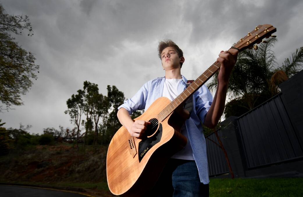 ROCK ON: Country artist Freddie Bailey-Cook plays his new song When the Rain Comes that he wrote to raise money for farmers in drought. Photo: Gareth Gardner