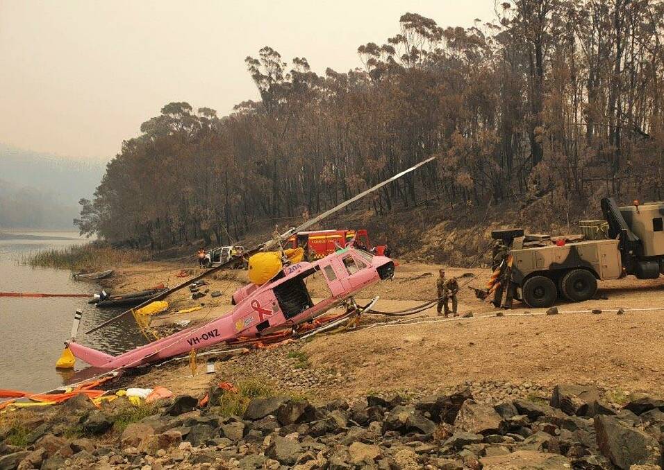 RETRIEVED: A joint effort has seen Armidale Fleet Helicopters' unit Lucy pulled from a dam where it spent the weekend submerged. Photo: BVSC