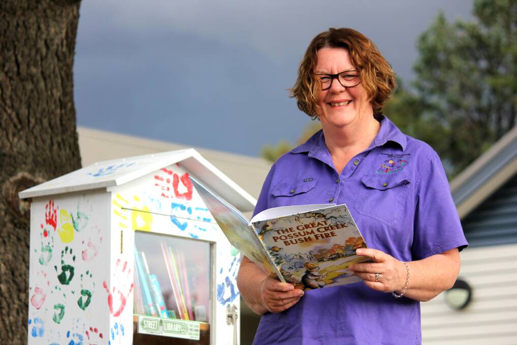 HAPPY HOUSE: Armidale Community Preschool director Sue Motley with the new street library they've installed. Photo: Madeline Link