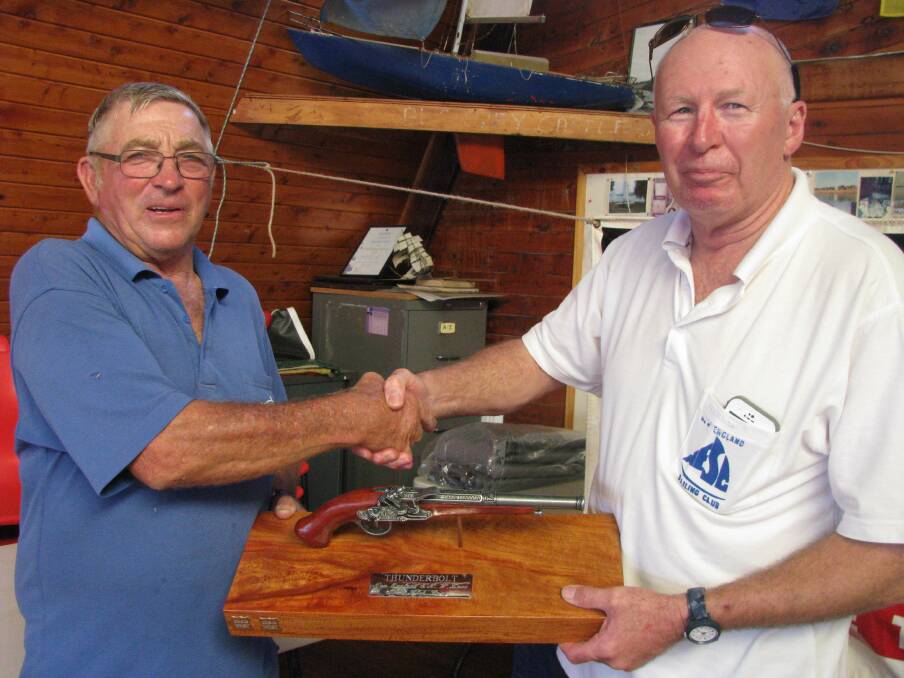 Good grip: New England Sailing Club commodore Bruce Floyd (right) presents the Thunderbolt Trophy to Lake Keepit Sailing Club commodore Ian Pine (left).