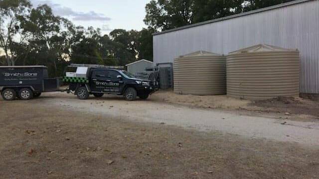 Safety net: The tanks, donated by Bunnings Warehouse Inverell and Best Employment have been installed in Bundarra as a result of GemFM and 2NZ's bottled water drive. Photo: Supplied.