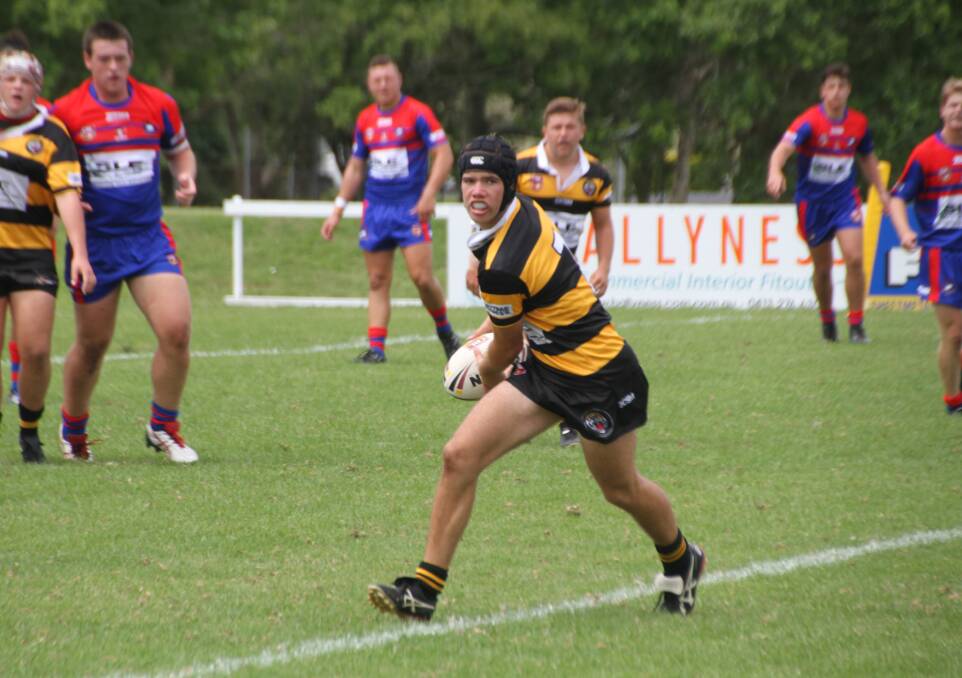 On the attack: Inverell's Will McAuliffe, in action against Newcastle, was pulling the strings as the Greater Northern Tigers 18s posted their first win on Saturday.