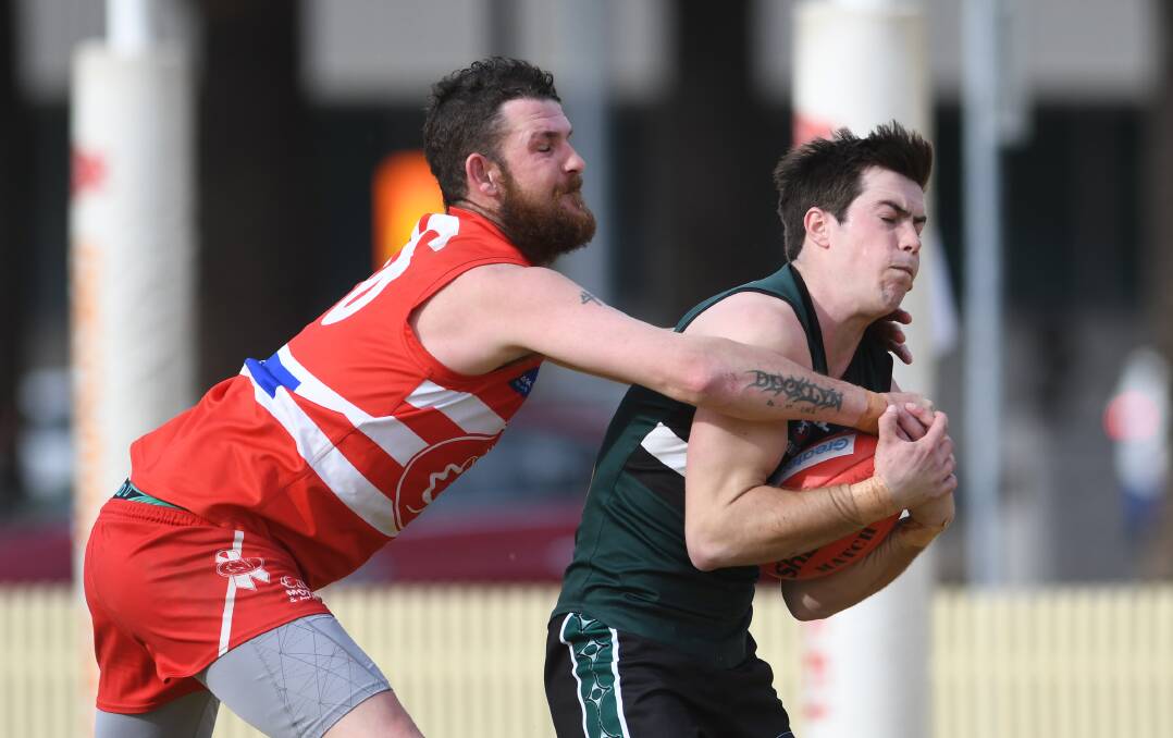 Nick Locke, here taking this chest mark, was outstanding in the midfield for the New England Nomads against the Tamworth Swans on Saturday. Photo: Gareth Gardner