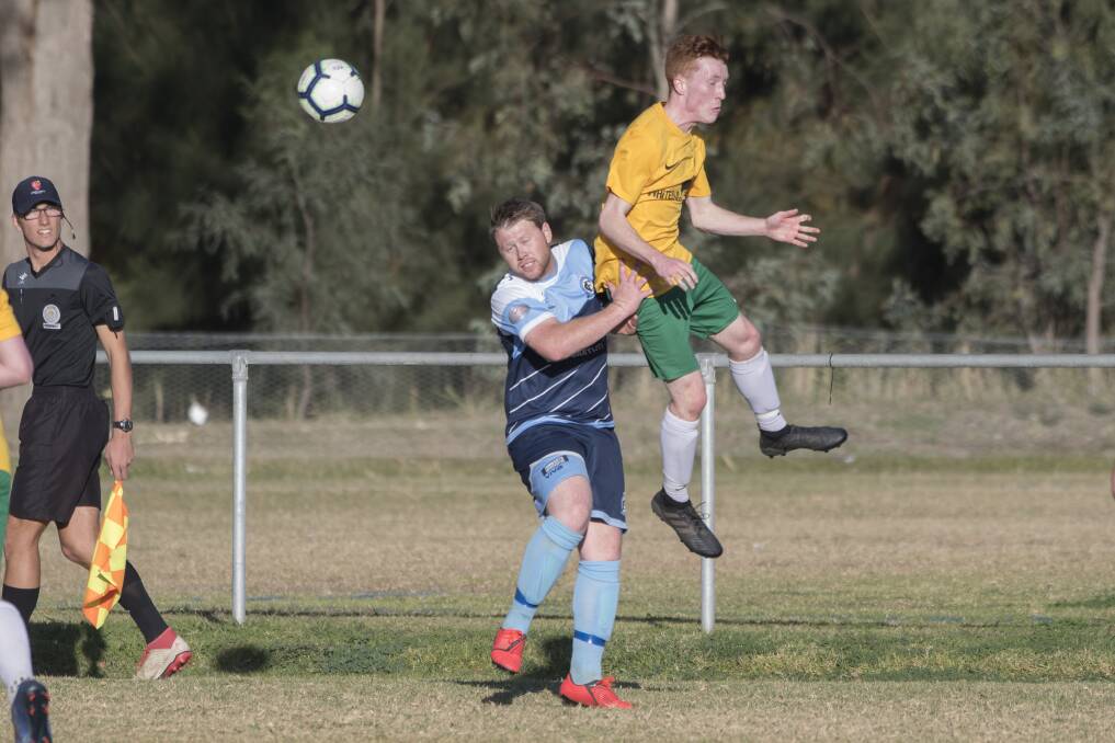 At the top of his game: South Armidale's Liam Neeson soars to win this header. He slotted a hat-trick as the Scorpions beat Tamworth FC 4-1. Photo: Peter Hardin 260519PHE105