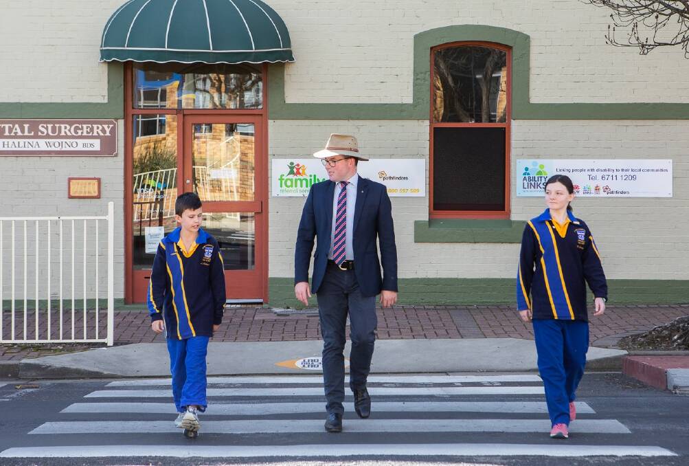 Northern Tablelands MP Adam Marshall (centre) with St Mary's Catholic Primary School captains Luke Schmude and Medeleine Cowley.