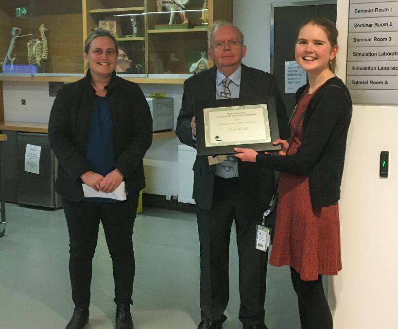 Professor Michelle Guppy and Professor Bob French present Dr Erin Bourke with her Bob French award. Photo: supplied.
