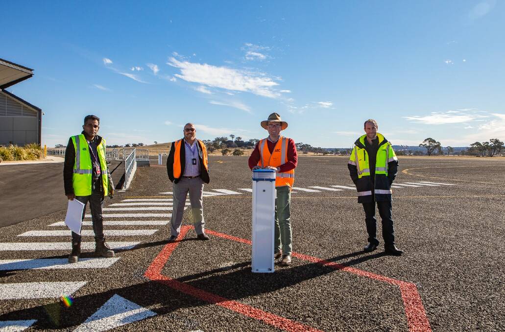 Project manager Don Nilantha, Airport manager Billy Gleeson-Barker, Northern Tablelands MP Adam Marshall and project assistant Sam Jacobson inspect the extended airside parking apron.