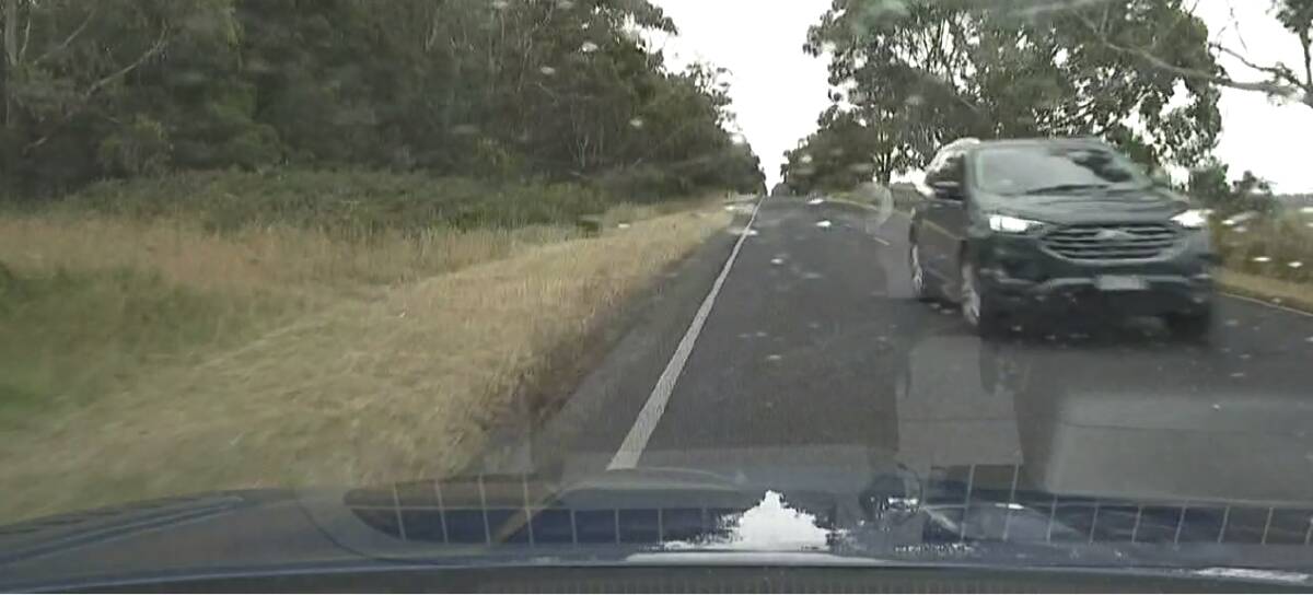 NEAR MISS: Police have released dash cam footage of a Ford wagon narrowly avoiding a head-on crash with a highway patrol car at Naringal. Picture: Supplied.