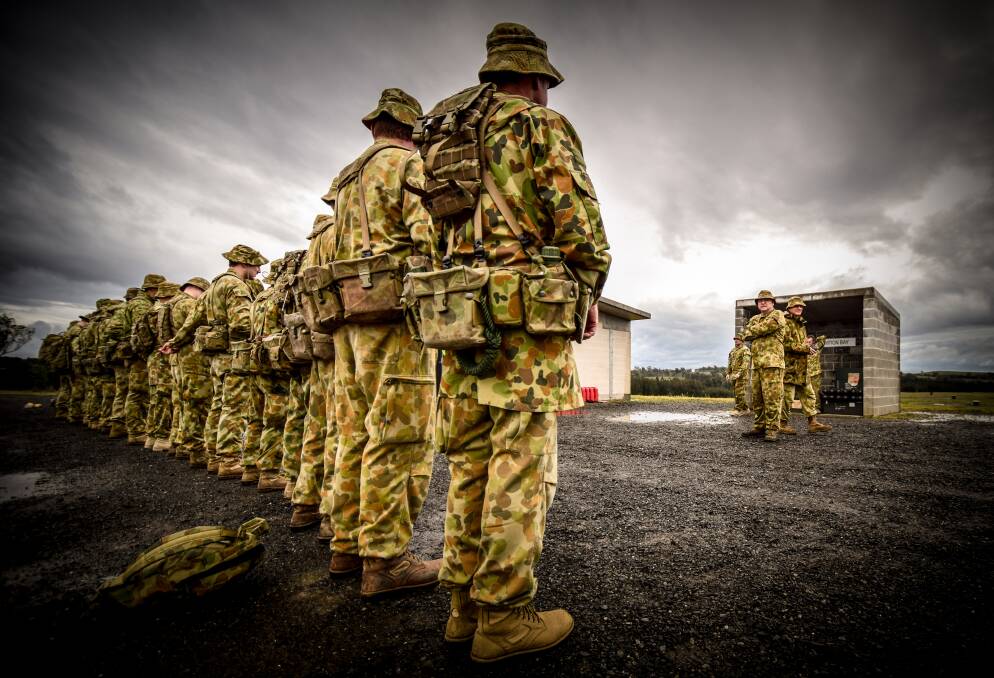 BRIEFING: Lancer reserves fall in at Lone Pine Barracks' firing range ready for training.
