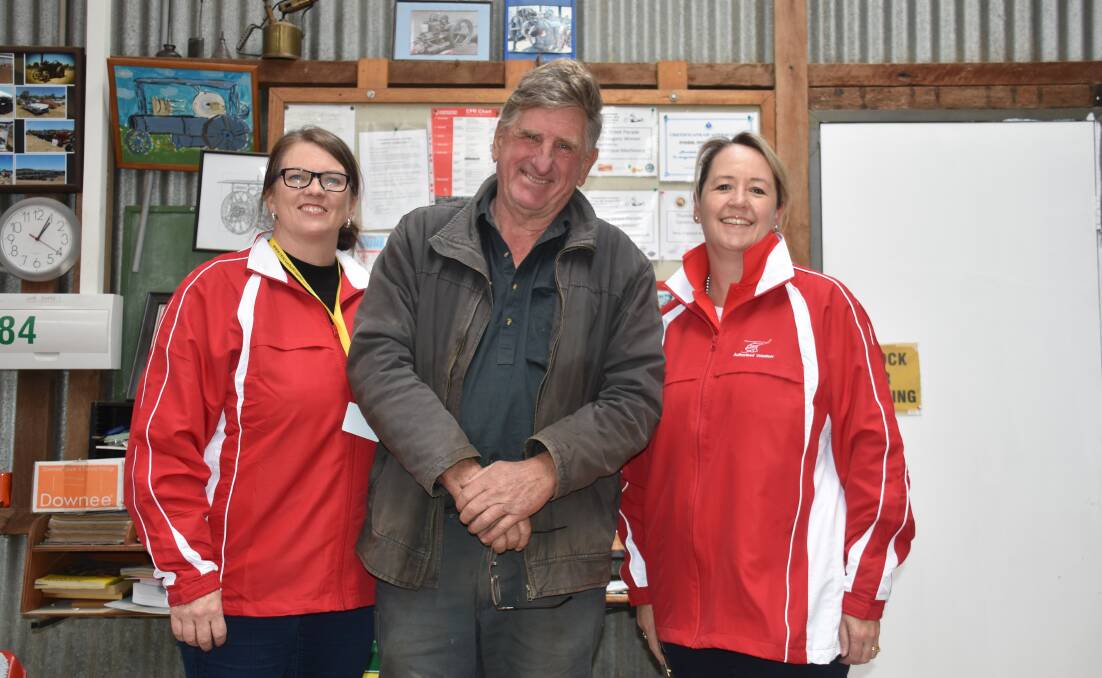 Rob Taber, president of the New England Antique Machinery Club, with the Westpac Rescue Helicopter Service's Meg Georkas and Amanda Frost. Photo: Nicholas Fuller