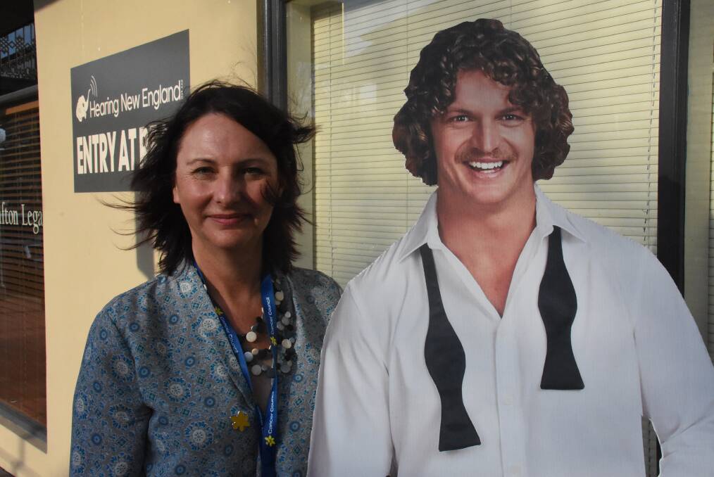 AND FRIEND: Cancer Council NSW's Tracey Cullen with a cardboard cutout of Nick Cummins. Photo: Nicholas Fuller