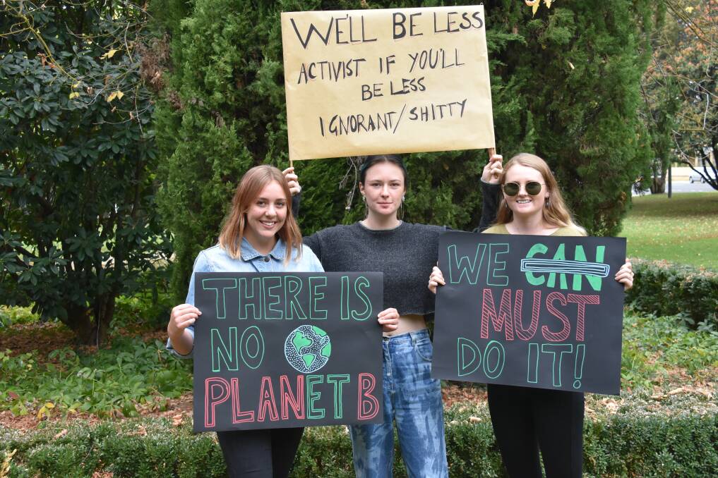 PROTESTERS: Penny Rummery, Lucy Neary, and Kaytie Cooper, from Uralla. Photo: Nicholas Fuller