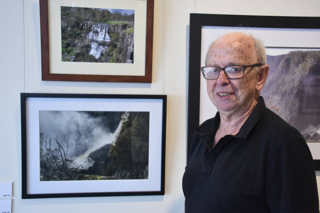 WATERFALL: Jim Walmsley with his photograph of Dangars Falls. Photo: Nicholas Fuller.
