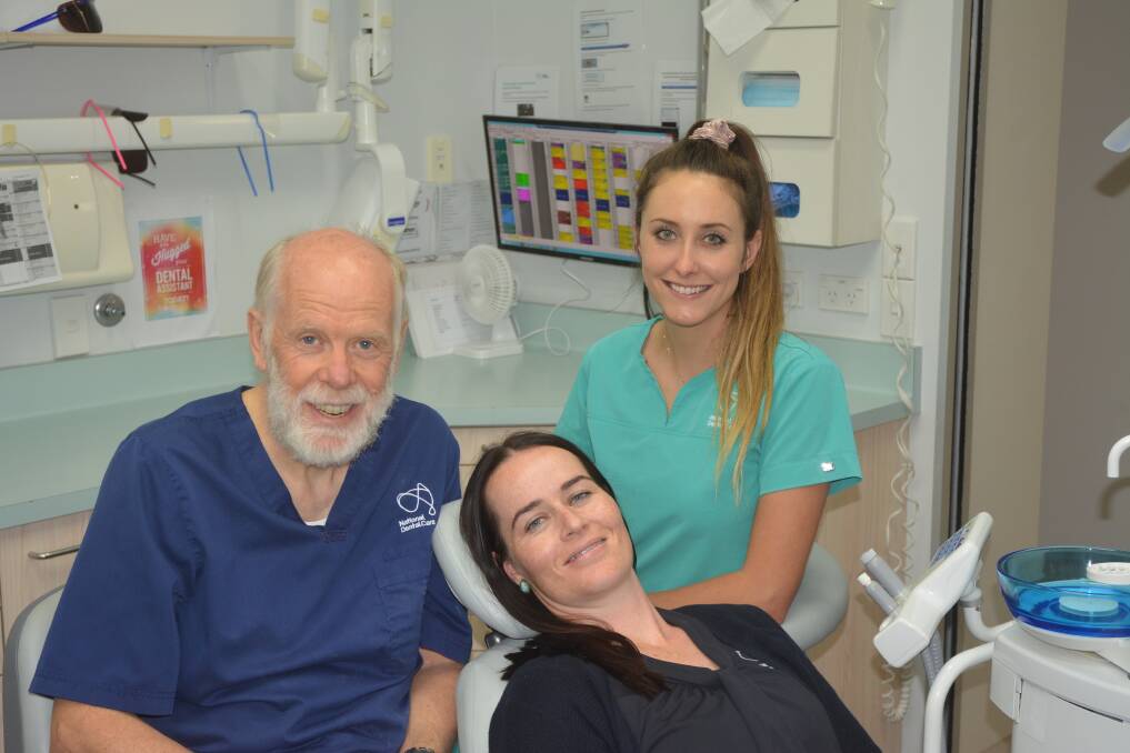 TOOTHY SMILES: Dentist Dr Rob Dewhurst, with Tara Poss (in chair) and assistant Natalie Hammond.