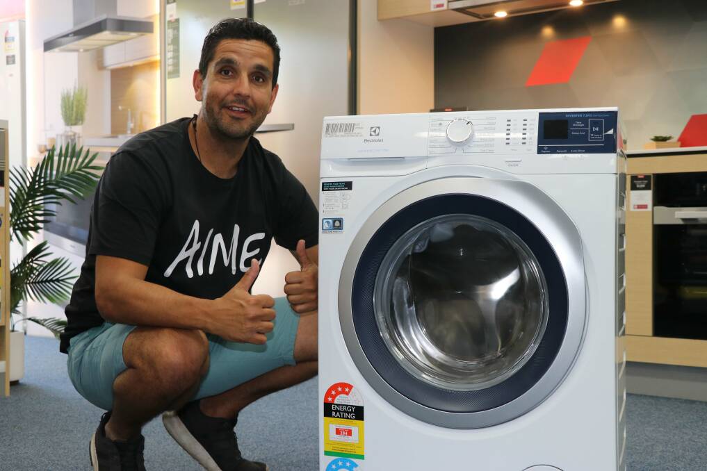 Councillor Brad Widders with the water-efficient front-loading washing machine up for grabs in a free competition at this Sunday's National Water Week Expo. Visit Council's website to see Cr Widders in the Brad & Jono's Water Saving Tips videos.