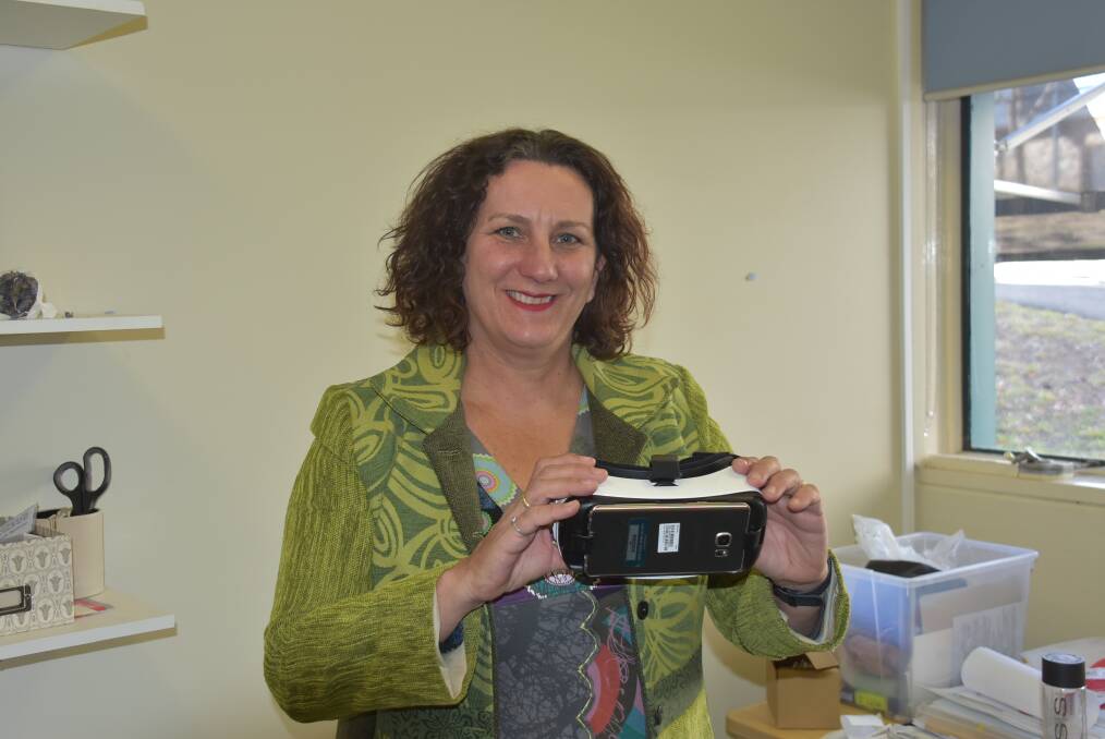 SCIENTIST AT WORK: UNE neuroscientist Dr Deborah Apthorp with her virtual reality goggles. Picture: Nicholas Fuller