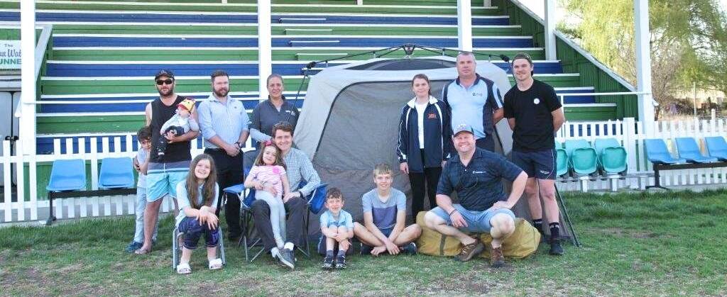 FATHERS AND CHILDREN: Front row: Adam Simpkins with daughters Amelia, Darcy and son Ethan. Fathering Project regional co-ordinator John Everett and son Ryan.
Back row: Rams A-grade coach Luke Kirkby with his youngsters Christian & Luca, Jake McFayden, Rams president Jess Smith, Sophie, Dean and Tyler Carson. Photo supplied.
