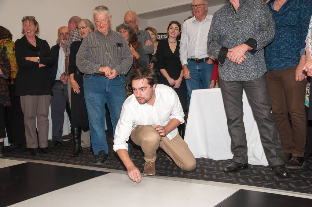 ALL IN A GOOD CAUSE: Tossing coins at the fund-raising dinner. Photo: Terry Cooke