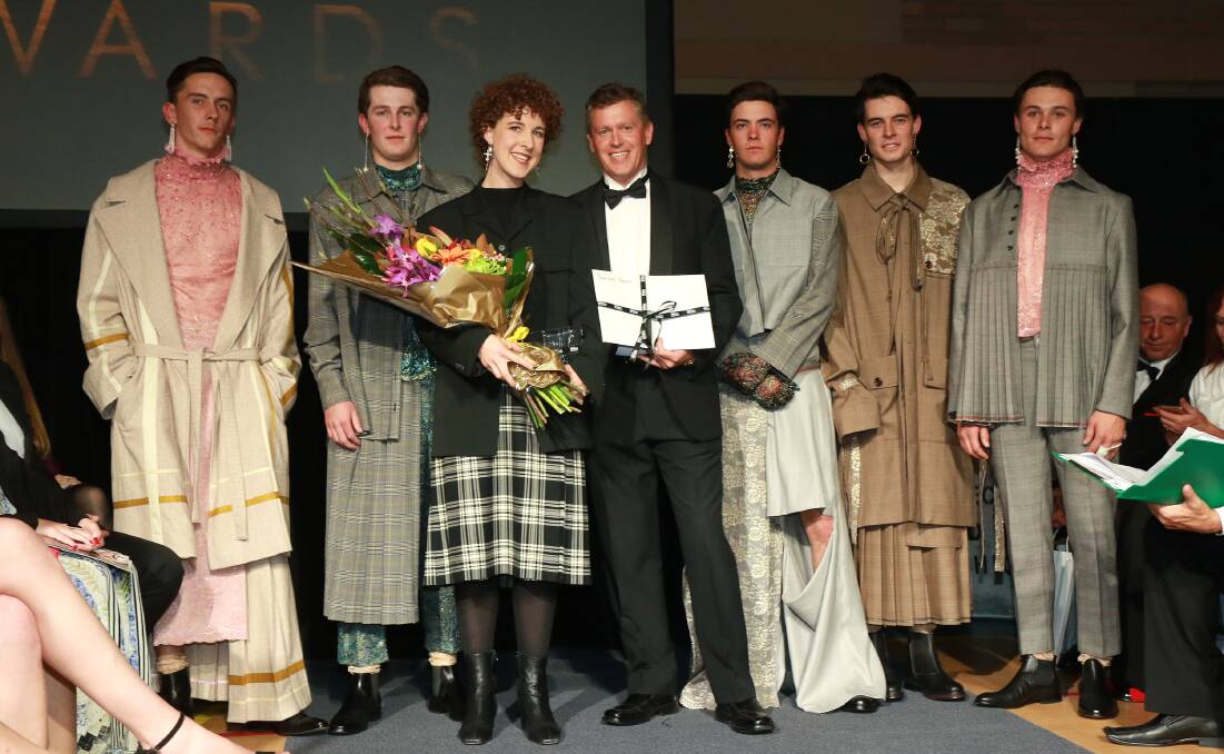 WINNING WEAR: Supreme prize winner Gina Snodgrass, Phil Gream from Roberts & Morrow, with models