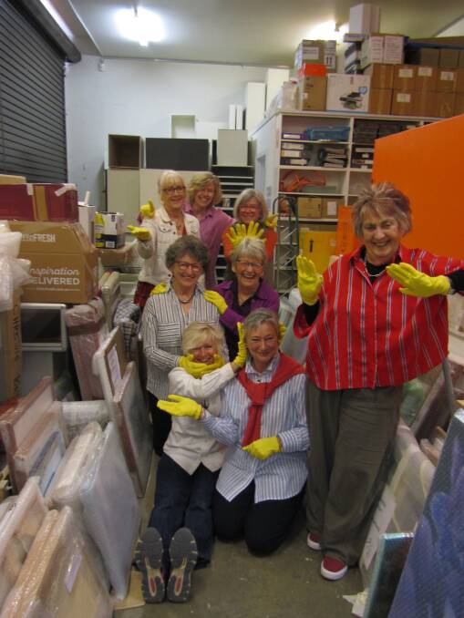 Packsaddle volunteers unwrapping this year's art works. Photo supplied.
